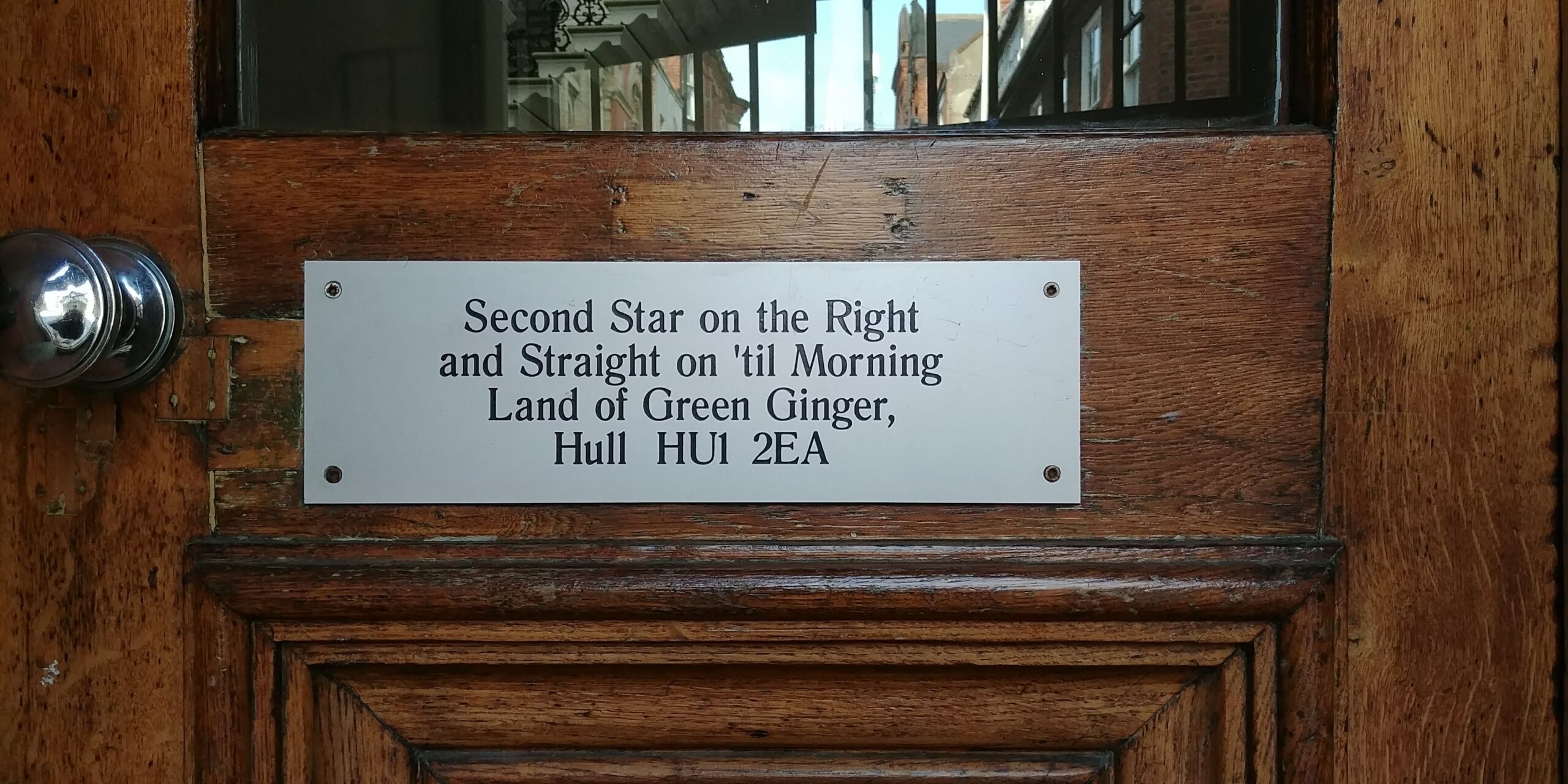 Address plaque on a door in Hull, England